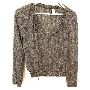 Women’s black & white polka dot blouse.